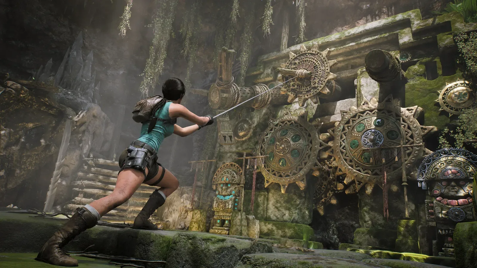 Official Legacy of Atlantis image of Lara interacting with a mechanical tomb puzzle